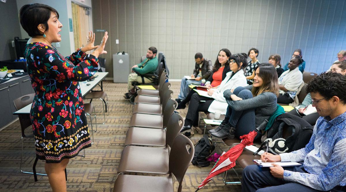 Magdalena Barrera speaking in front of an audience.